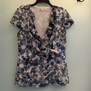 Side zip. Floral pattern has hints of light pink and blue